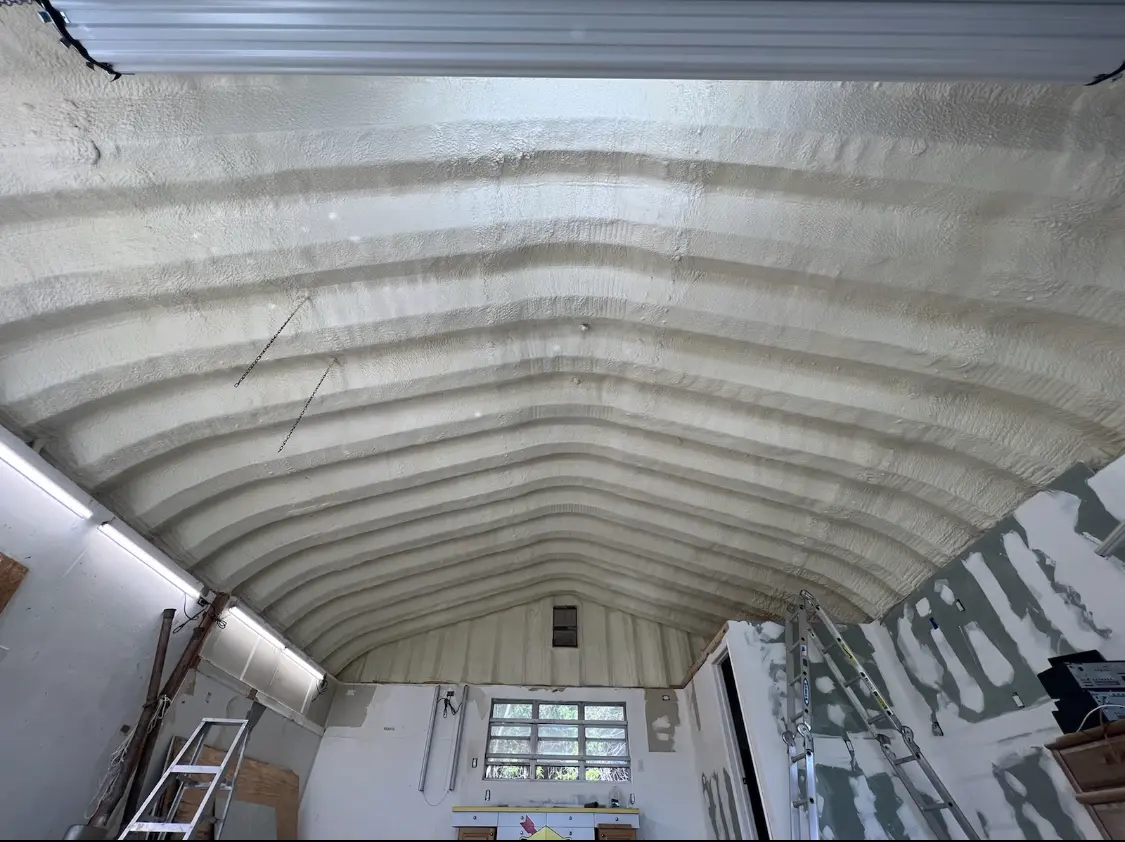 Spray polyurethane foam applied to the underside of a metal roof deck in Bay City
